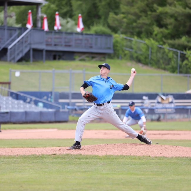 Nathan Pirog pitches at Norwich