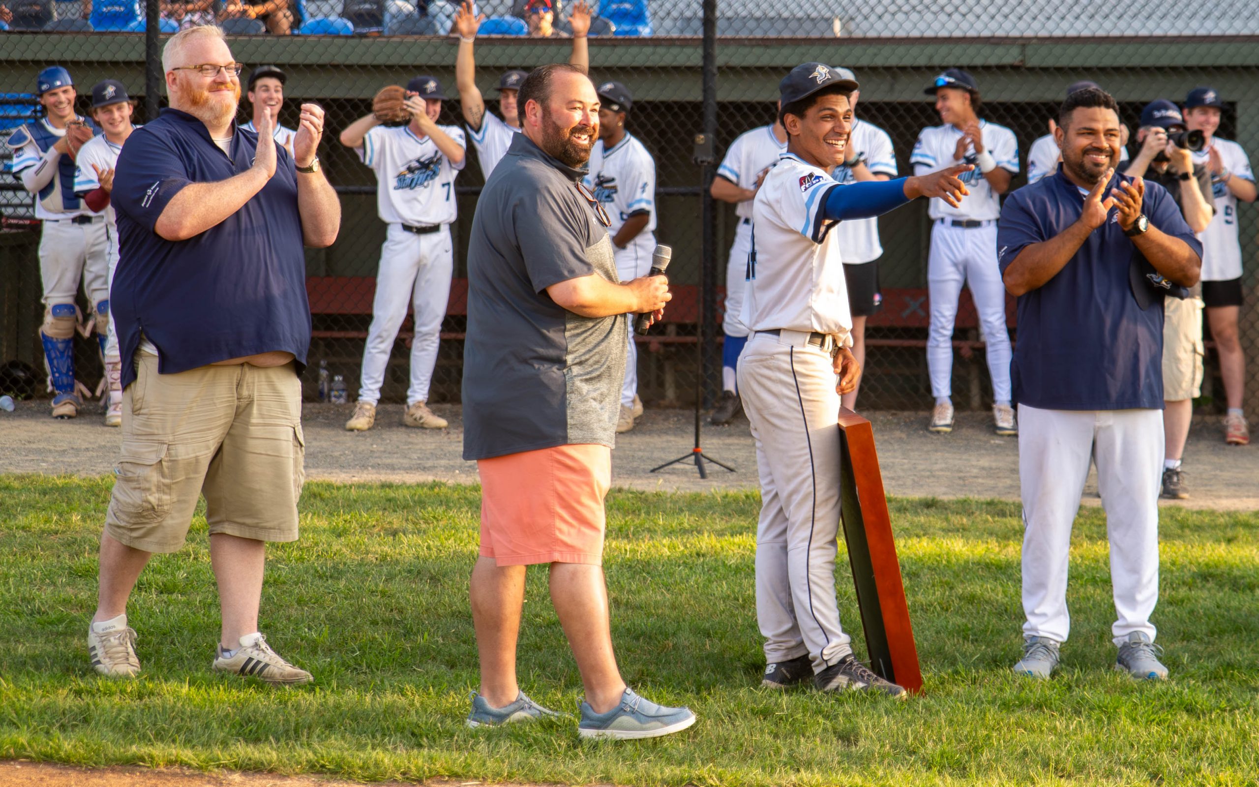 Josh Frometa, along with Hunter Golden, Chris Thompson, and Paul Bonfiglio, as Frometa's number retirement was revealed.