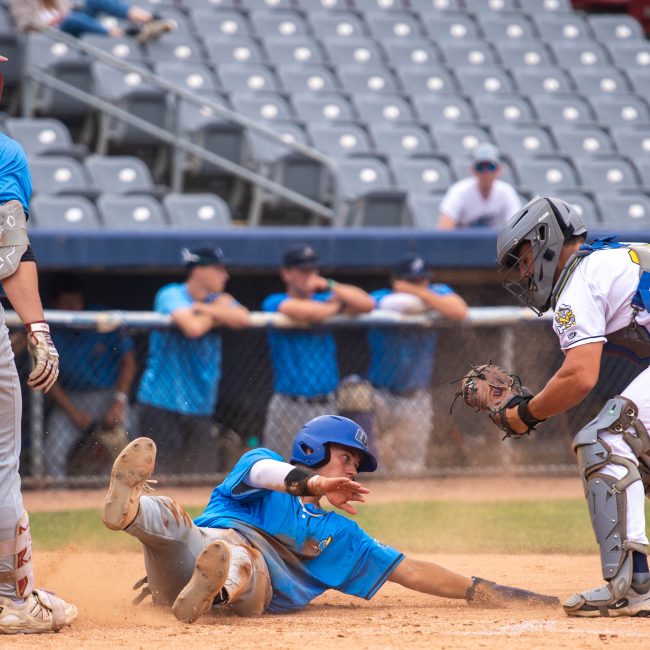 Riggs Catlin slides into home