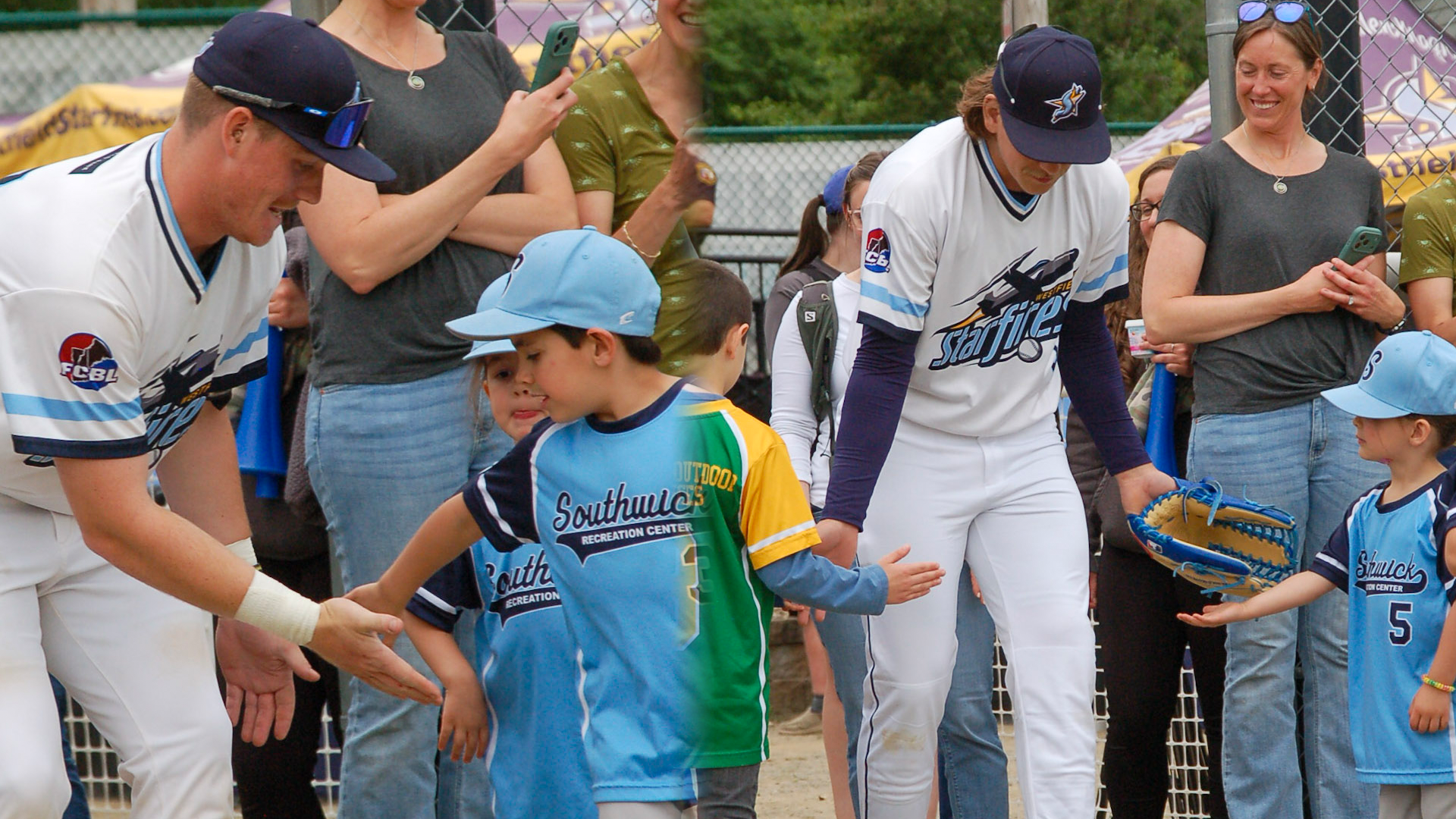 A collage of pictures of Starfires players high-fiving fans at the team's opening night