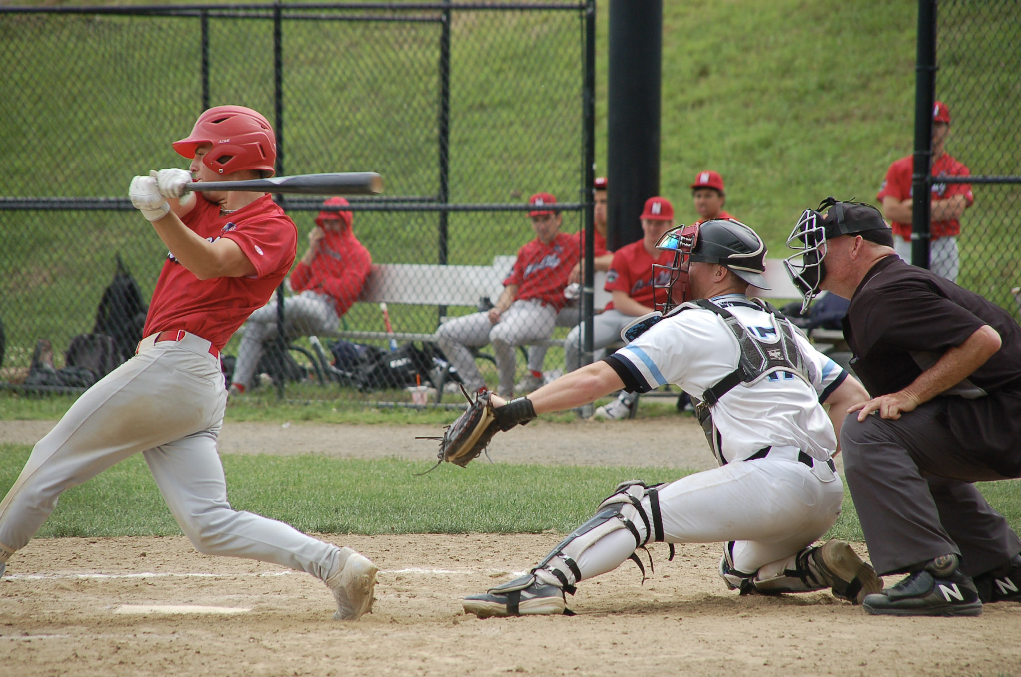 Will Briggs catches a swinging strike